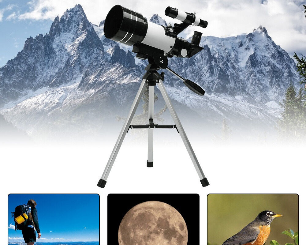 Telescope set up outdoors with a mountain landscape behind it
