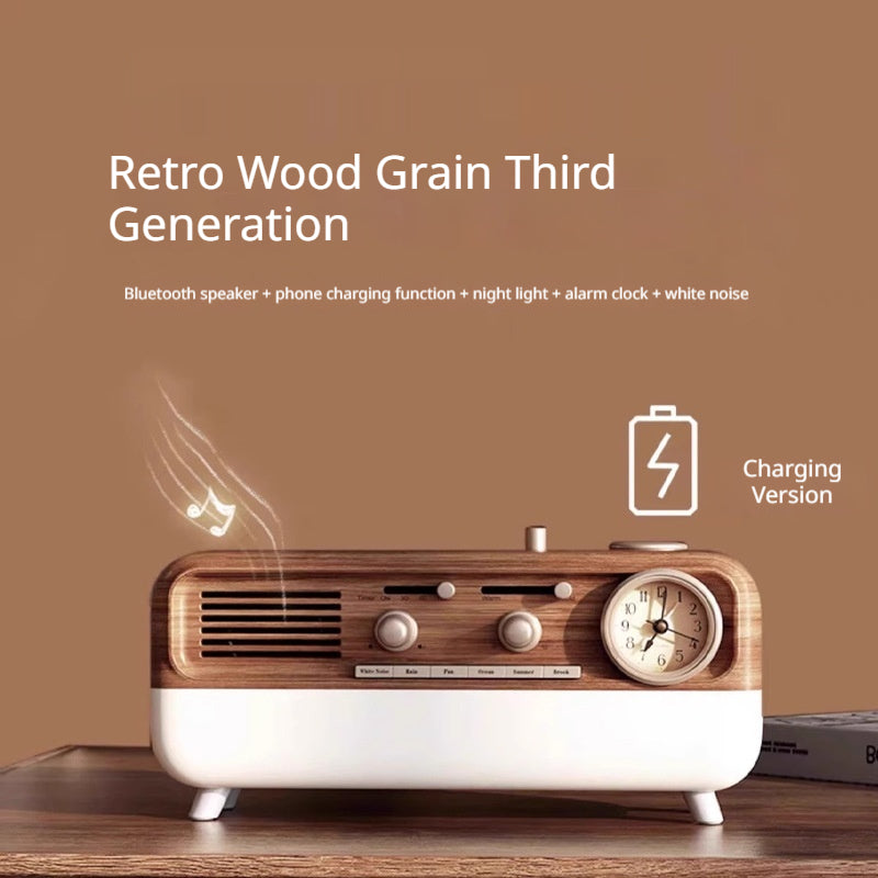 Detail close-up of the walnut-grain retro speaker showing the alarm clock face and tactile knobs
