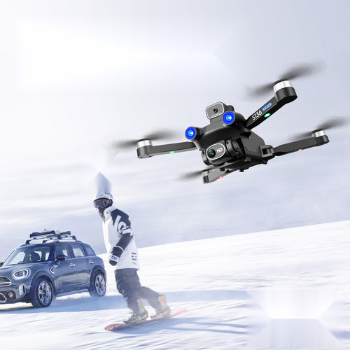GPS drone following a snowboarder across the snow, intelligent follow mode