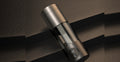 Hydrogen water bottle resting on premium leather in a light-luxury still life