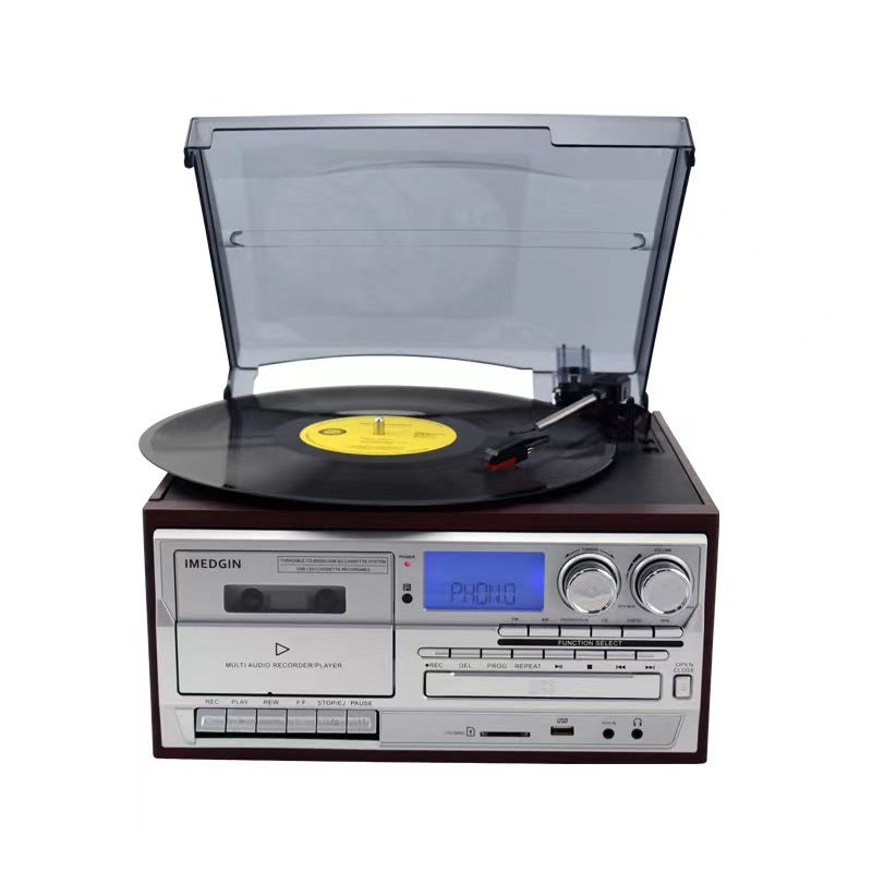 Front view of the vintage turntable showing cassette deck, CD slot, radio display and control panel
